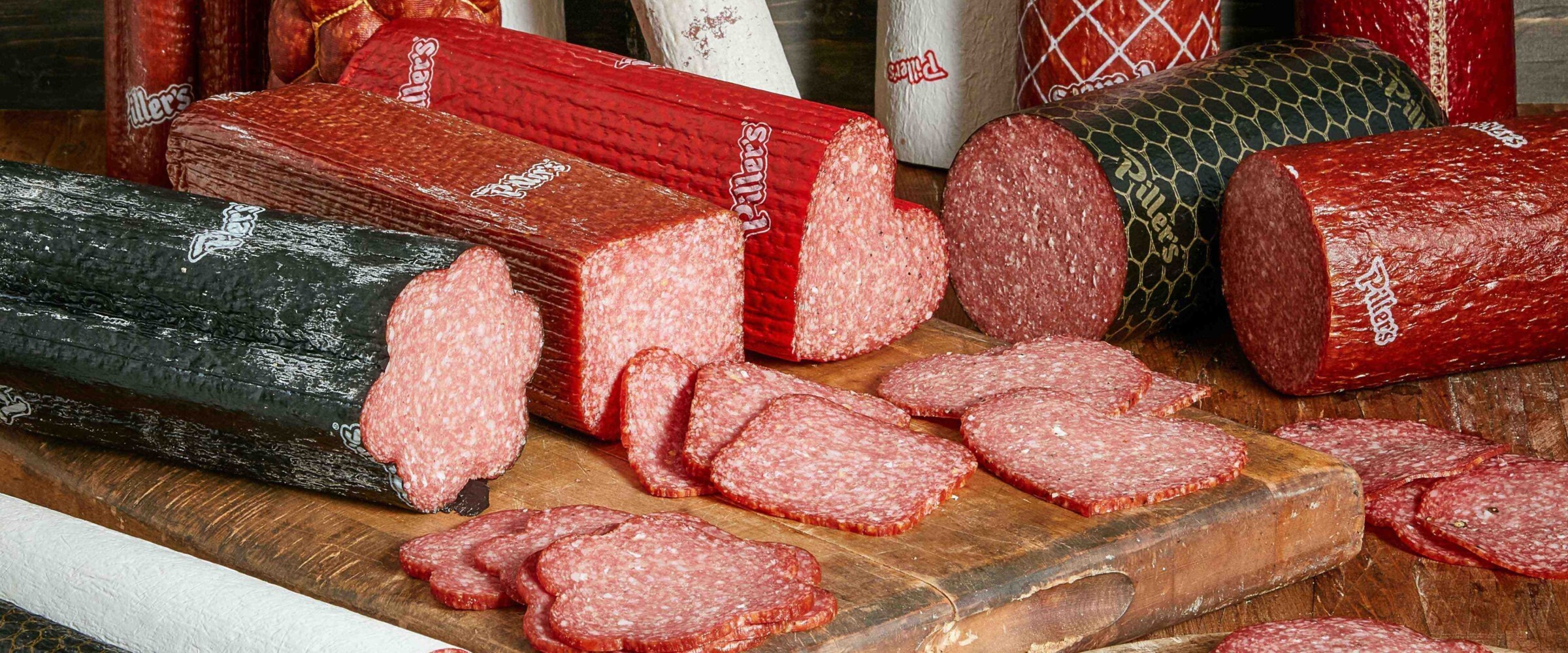 Group shot of salami pieces on wood board