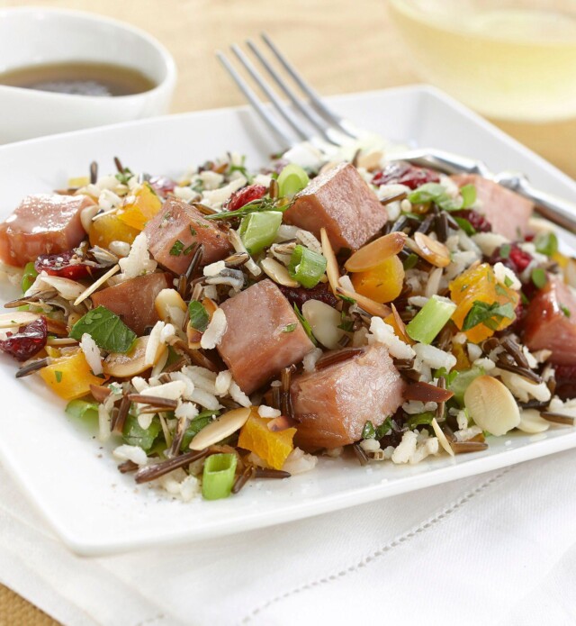 Ham and rice medley salad on a white plate