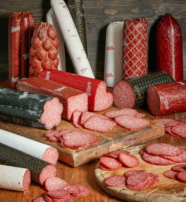 Group shot of salami pieces on wood board