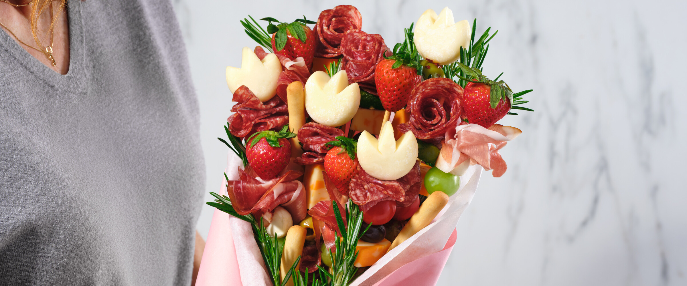 Mix of meats, fruits, and cheeses to create a charcuterie bouquet.