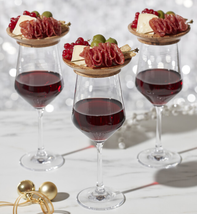Mini Charcuterie boards on top of wine glasses