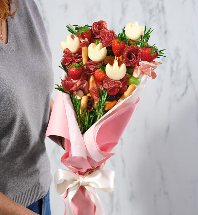 Mix of meats, fruits, and cheeses to create a charcuterie bouquet.