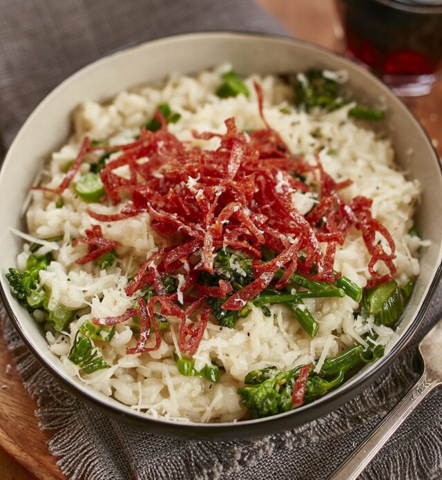 Risotto with salami in a white bowl